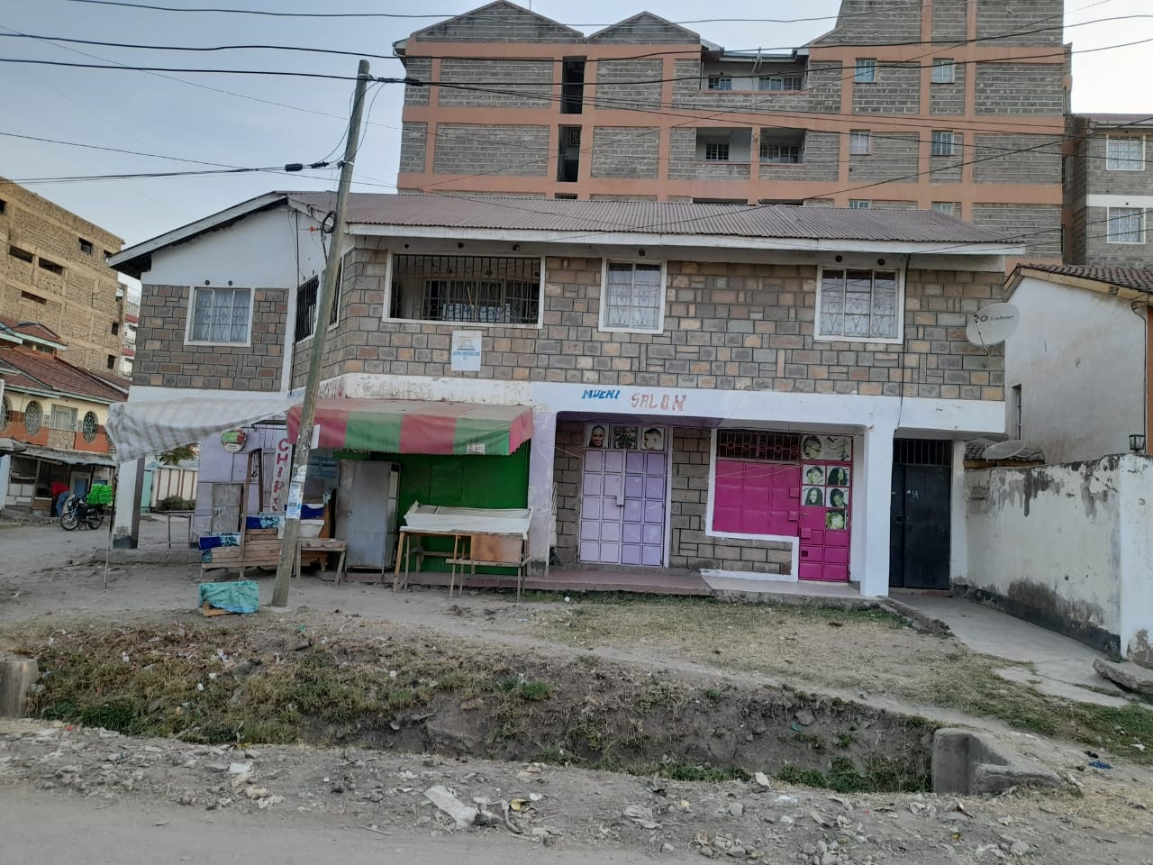 Commercial Property For Sale. Situated in a corner plot measuring 66 by 75, featuring commercial shops and flats. Asking price. 24 M. Musilli Homes.