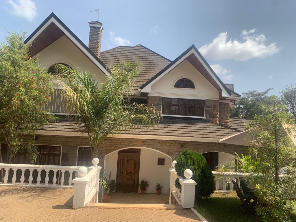 Spacious 4 Bedroom Townhouse For Sale in Runda with a modern kitchen, gazebo, manicured lawn and electric fence. Asking Price. 120 M. Musilli Homes.