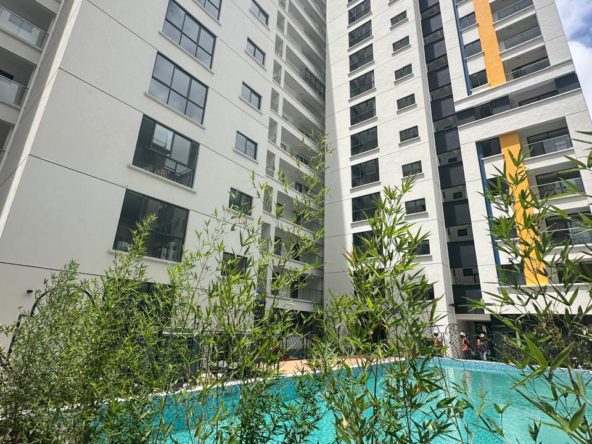 Modern 3 Bedroom Apartment plus DSQ for Sale Living room with a balcony, Lifts, and swimming pool, Gym, and Kids play area. Asking Pice: 18.5 M. Musilli Homes.