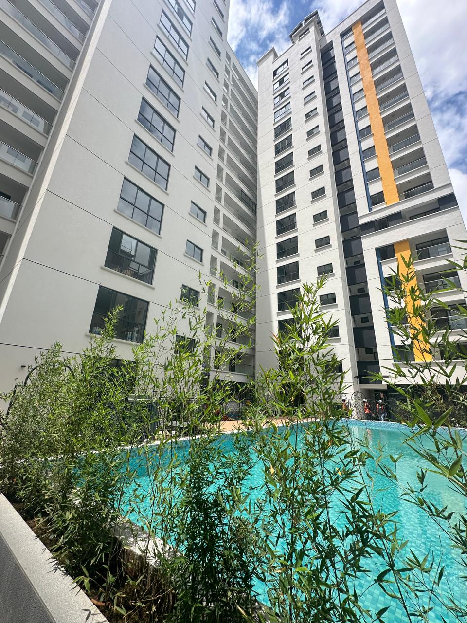 Modern 3 Bedroom Apartment plus DSQ for Sale Living room with a balcony, Lifts, and swimming pool, Gym, and Kids play area. Asking Pice: 18.5 M. Musilli Homes.
