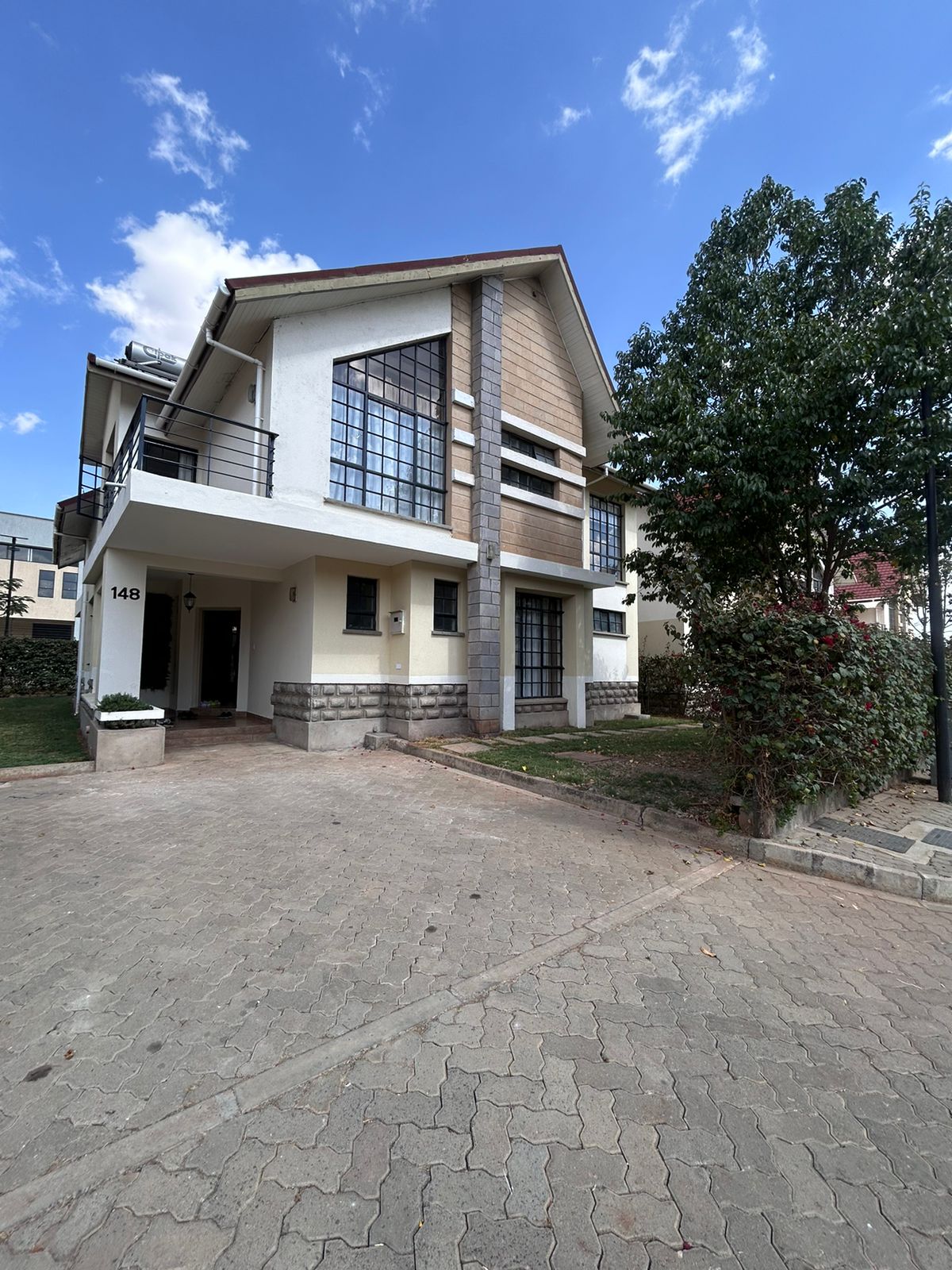 Spacious 4 Bedroom House Plus DSQ for Sale in Athi River. Sits on 1/8th Acre, has 5000L water storage, and ample parking. Sale Price: Ksh 15M. Musilli Homes