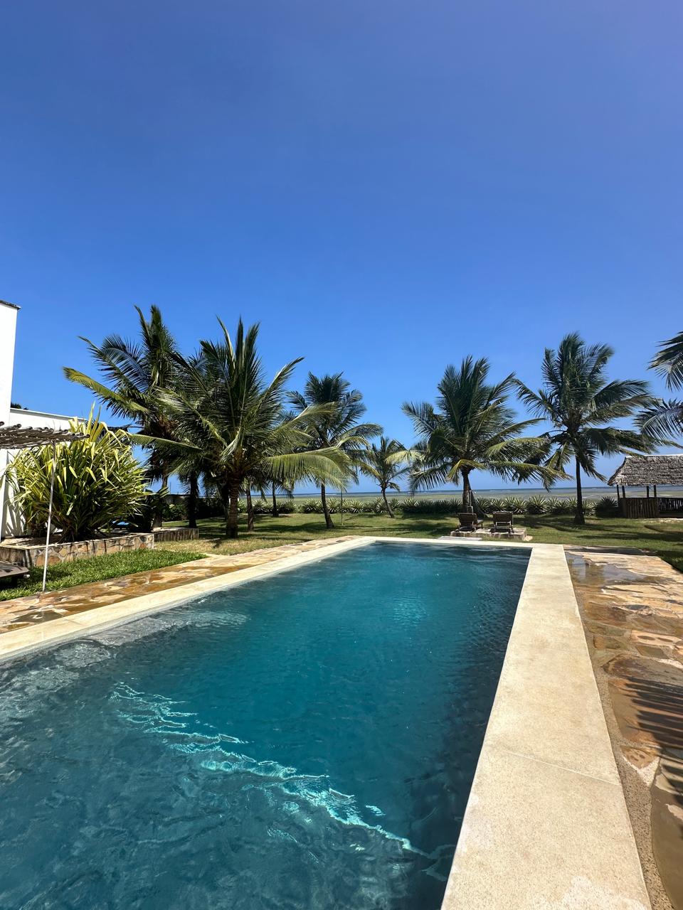 Modern 2 Bedroom Beachfront Apartment for Sale. Has a master ensuite, balcony, fully furnished and has a private beach access. Sale price: Ksh 25M. Musilli Homes